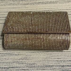 Evening clutch purse- shiny gold colored w/rhinestones on the top of the fabric
